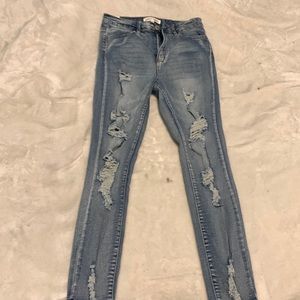High waisted ripped blue jeans